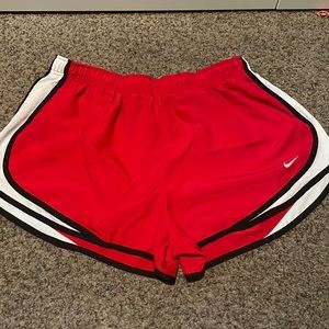 Red Nike shorts